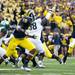 Michigan senior quarterback Denard Robinson throws in the first quarter against Michigan State on Saturday. Daniel Brenner I AnnArbor.com
